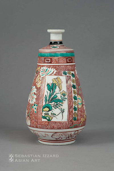 A WINE BOTTLE WITH FLORAL PANEL DECORATION  Hizen ware, Kokutani type:  porcelain with colored enamel decoration Kambun era, 1661–72 H: 25.1 cm