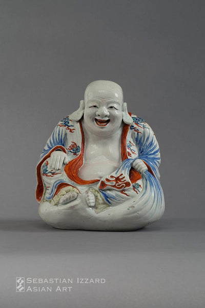 A PORCELAIN FIGURE OF HOTEI  Hizen ware, Kakiemon type: porcelain with colored enamel decoration Edo period, late 17th century H: 25 cm