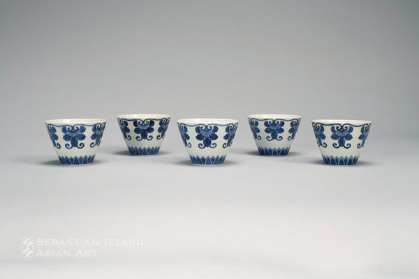 FIVE SMALL CUPS WITH STYLIZED BUDDHIST JEWEL BORDER