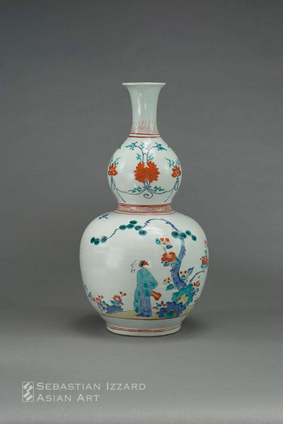 A PAIR OF GOURD-SHAPED BOTTLE VASES  Hizen ware, Kakiemon type: porcelain with colored enamel decoration  Edo period, late 17th century, circa 1670−90 H: 40.7 cm; D: 20.8 cm Exhibited: The Kyushu Ceramic Museum, ed. 1999. Exh. Cat.  Kakiemon-sono yoshiki no zembo/Kakiemon--the Whole Aspect of the Kakiemon style, no. 40.