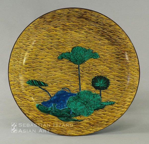 LARGE DISH WITH LOTUS DESIGN Hizen ware, Aode-Kokutani type: porcelain with colored enamels Edo period, circa 1650 41.9 cm diameter