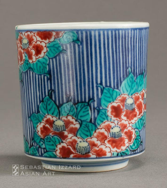 WINE CUP WITH DESIGN OF CAMELLIA BLOSSOMS Hizen ware, Nabeshima type: porcelain with underglaze blue and colored enamels Edo period, 17th century 6.7 cm high