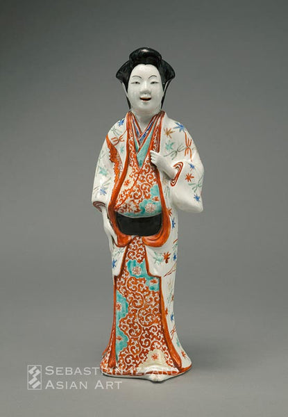 STANDING FIGURE OF A BEAUTY  Hizen ware, Kakiemon type; porcelain with iron-red over-glaze enamels and gilt details  Edo period, circa 1670–90 H: 39.1 cm Provenance: Olivier de Sartel