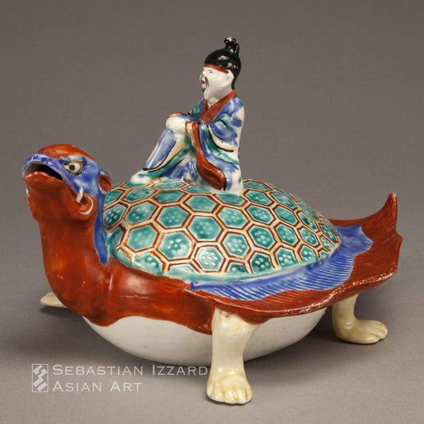 THE SAGE ROKO RIDING ON THE BACK OF A TORTOISE Hizen ware, Kakiemon type; porcelain with overglaze enamels  Edo period, ca. 1680s  H. 12.1 x W. 14 x D. 22.9 cm