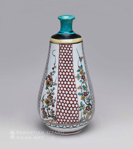 WINE BOTTLE WITH FLORAL PANEL DECORATION Hizen ware, Ko-Kutani type: porcelain with over-glaze iron-red, yellow, black, and turquoise enamels  Edo period, ca. 1660 Height 27 cm
