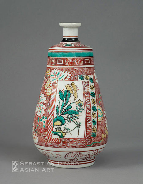 WINE BOTTLE WITH FLORAL PANEL AND SCROLLING VINE DESIGN Hizen ware, Ko-Kutani type: porcelain with overglaze iron-red, yellow, black, and turquoise enamels Edo period (1615–1868), ca. 1660 Height 10¼ in. (26 cm)