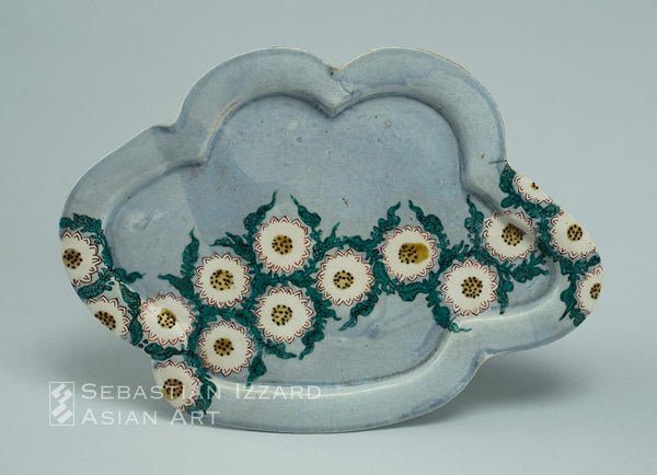 LOBED DISH WITH CHRYSANTHEMUM FLOWERHEAD DESIGN Hizen ware, early Nabeshima type: porcelain with colored enamels Edo period, ca. 1650-60 26.4 x 19 cm