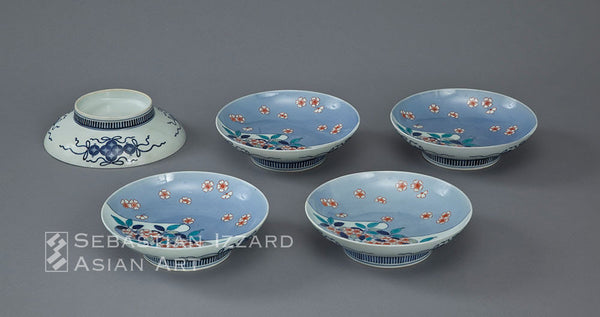 FIVE PORCELAIN DISHES Hizen ware, Nabeshima type: porcelain with underglaze blue, and over-glazed iron-red and colored enamel decoration Edo period, early 18th century, Hoei/Shotoku eras (1704−16) Diameter: each 20.3 cm approx.  Provenance: James Alexander Scrymser (1839−1918), acquired in Japan in either 1898 or 1899, and thence by descent