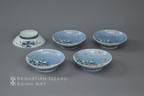 FIVE PORCELAIN DISHES  Hizen ware, Nabeshima type: porcelain with underglaze blue, and over-glazed iron-red and colored enamel decoration Edo period, early 18th century, Hoei/Shotoku eras (1704−16) Diameter: each 20.3 cm approx.  Provenance: James Alexander Scrymser (1839−1918), acquired in Japan in either 1898 or 1899, and thence by descent