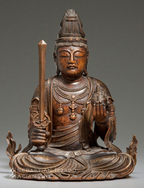 Seated Kannon Edo period, second half of 17th century Sandalwood, with lacquer  and gilt decoration 18 cm high Provenance: Georges de Batz 